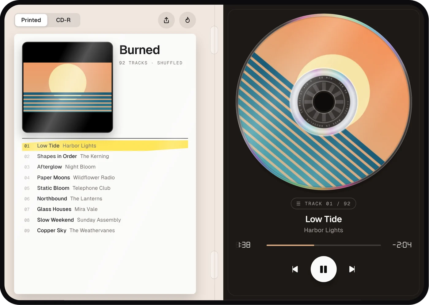 Burned on an unfolded iPhone Duo: booklet on the left, disc in its tray on the right